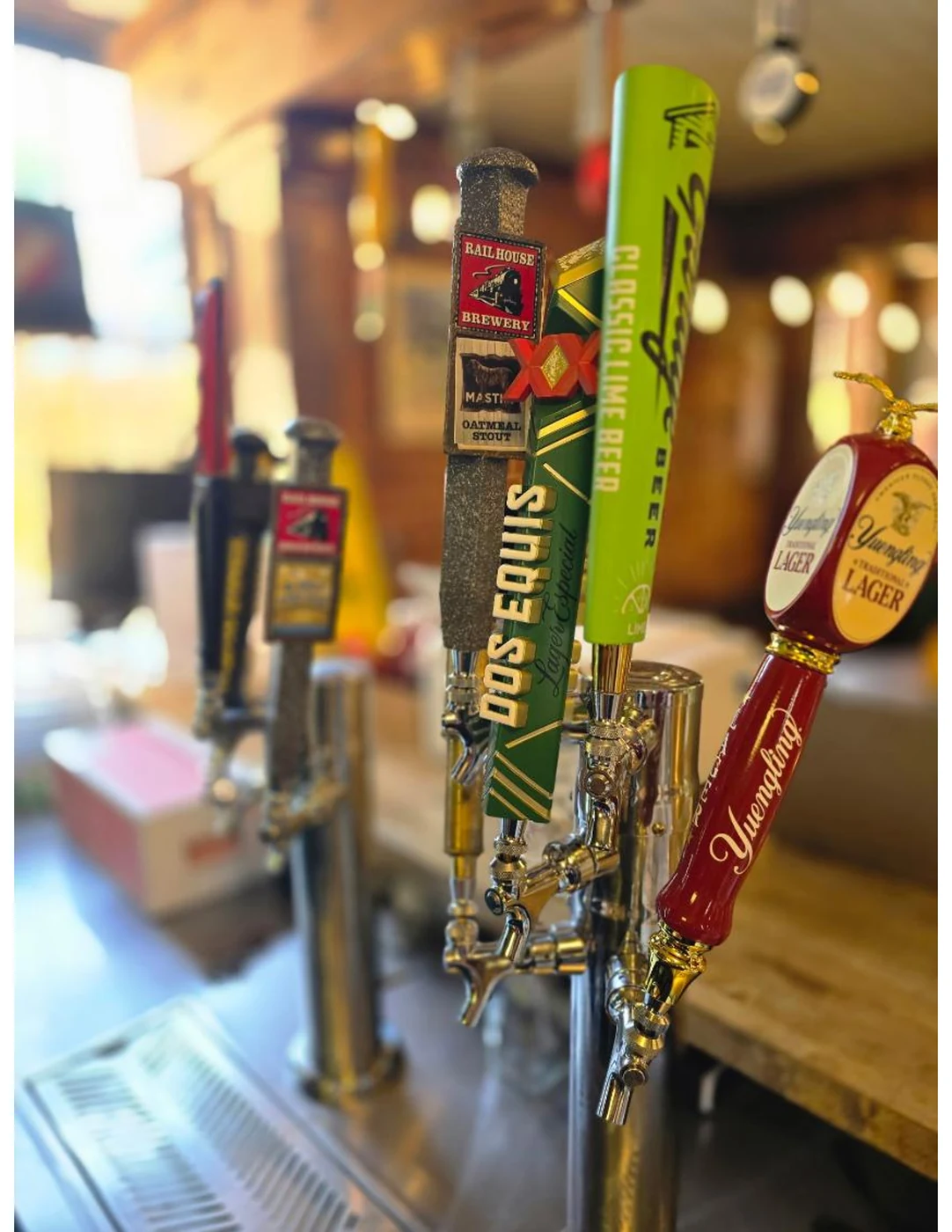 Draft beer tap handles at Dewberry Kitchen & Tap — Railhouse Brewery, Dos Equis, and local NC craft beer