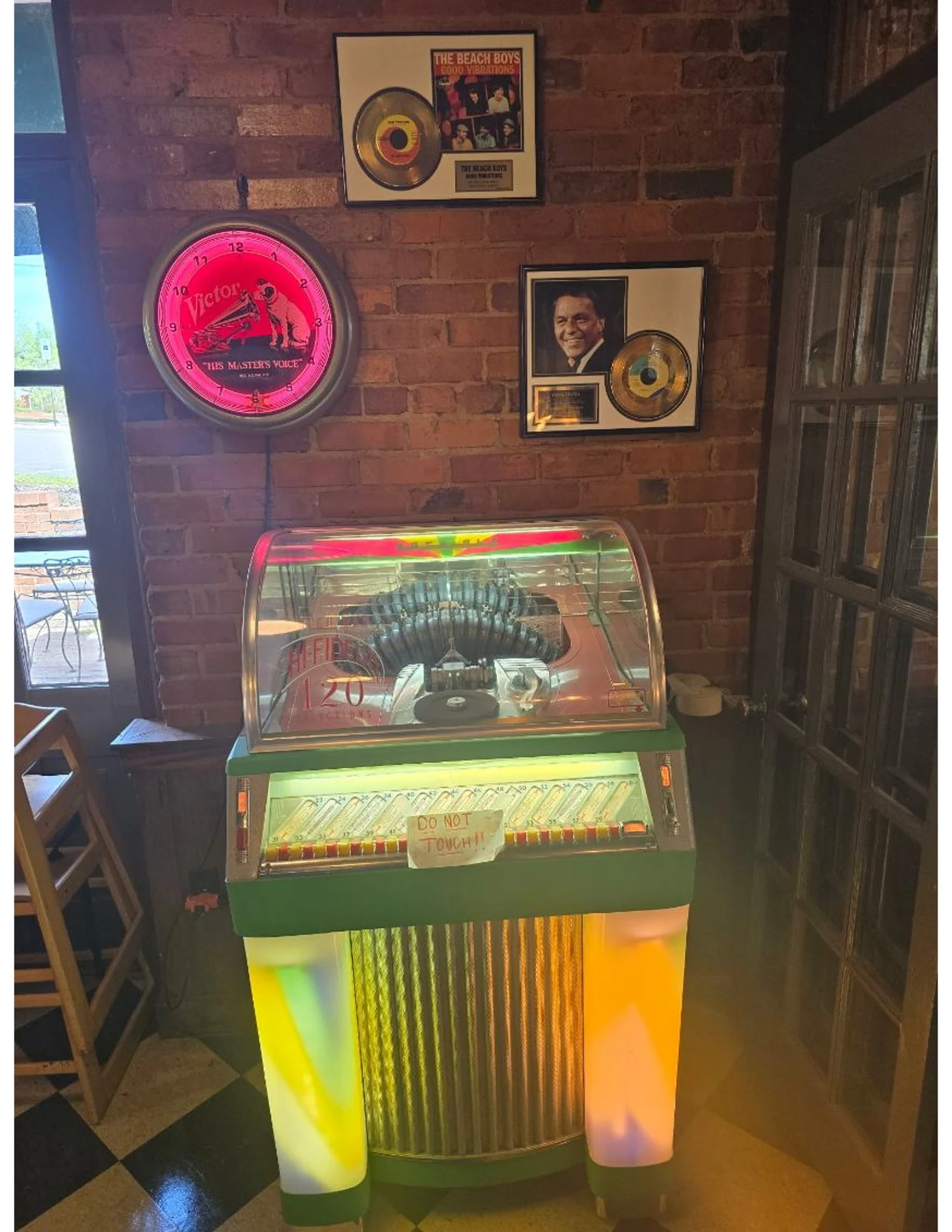 Vintage jukebox and wall memorabilia inside Dewberry Kitchen & Tap